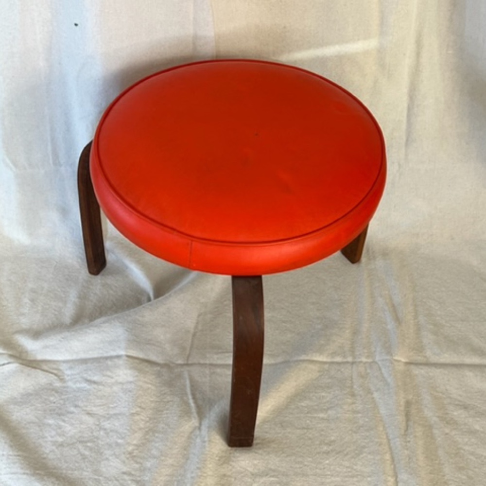 Mid-Century Modern round orange foot stool